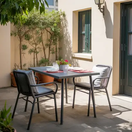 Cozy outdoor dining setup with plants